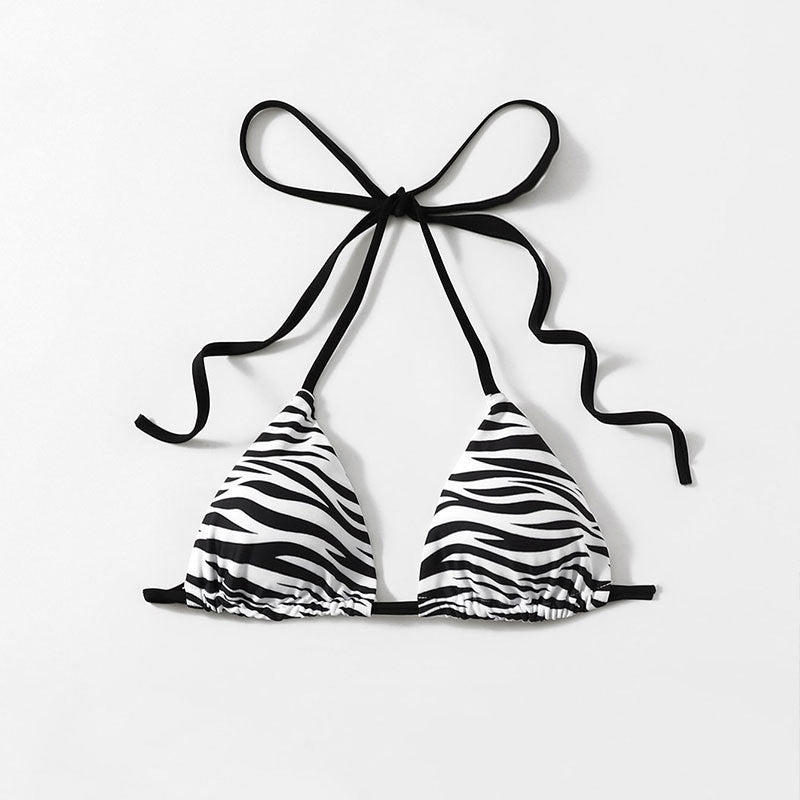 The Zebra Noir Padded Halter Bikini Top in black and white zebra print with ties.