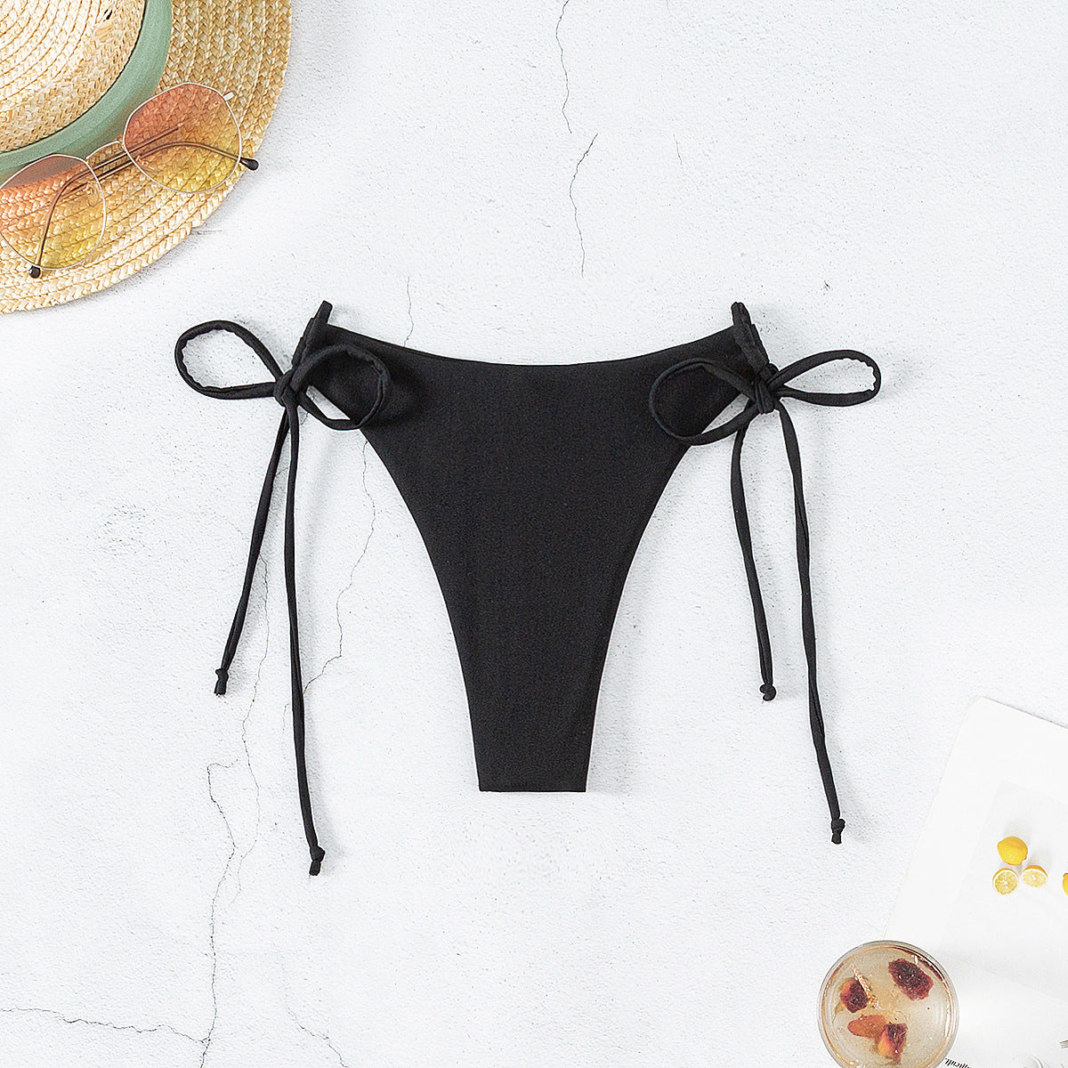 Affordable nice noir bikini bottom featuring lace-up details, perfect for a stylish beach outing.